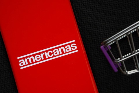 Dhaka, Bangladesh- 03 July 2025: A smartphone displaying the Americanas logo next to a miniature