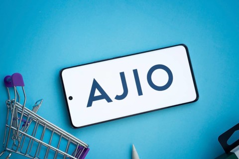 Dhaka, Bangladesh- 03 July 2025: Smartphone displaying AJIO logo with shopping cart on a blue