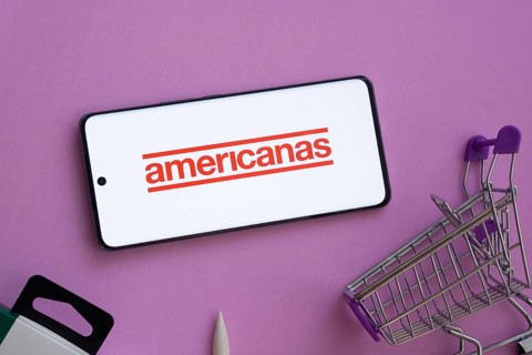 Dhaka, Bangladesh- 03 July 2025: Smartphone displaying Americanas logo alongside a shopping cart on