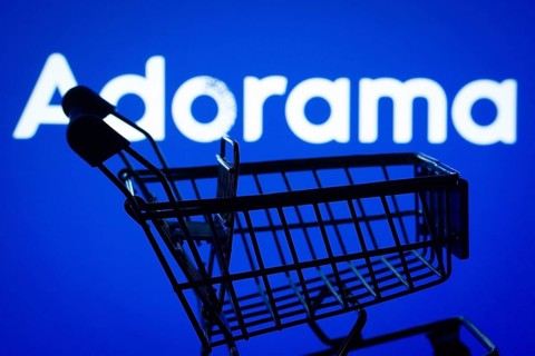 Dhaka, Bangladesh- 03 July 2025: Silhouette of a shopping cart in front of the Adorama logo,