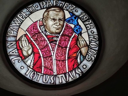 Religious motif, Pope John Paul 2 in a stained glass window in a small Polish village on the