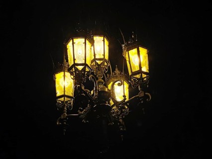 Glowing nostalgic street lamp at night creates a cozy atmosphere, Dresden