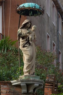 Statue of the Virgin with Christ Child under a canopy, Venice, Veneto, Italy
