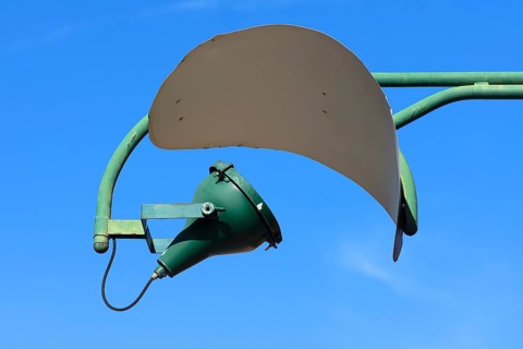 Old spotlight with reflector on a factory building, Giudecca Island, Veneto, Italy