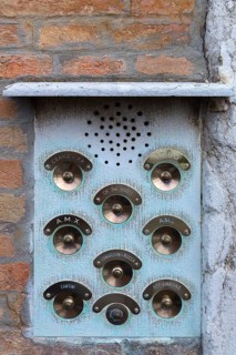 Brass bell buttons on a residential building, Venice, Veneto, Italy