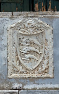 Coat of arms with three dolphins on a house wall, Venice, Veneto, Italy