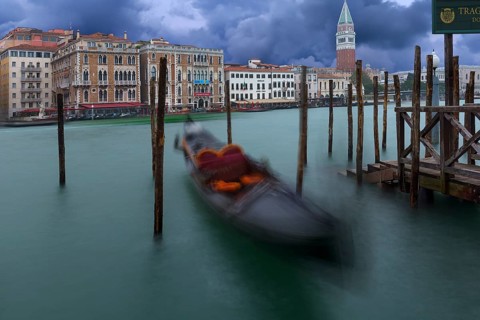 Gondola anchored in the Grand Canal, St Mark's Campanile in the back, Venice, Veneto, Italy