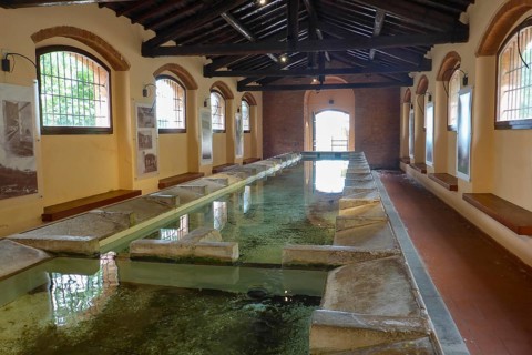 Historic wash house public washing place (Lavatoio) of Rio nell'Elba with running water and 18