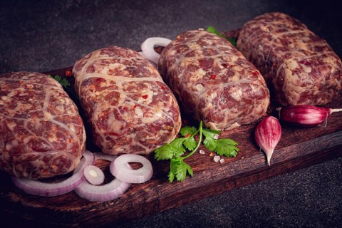 Raw apkhazura, a dish of Georgian cuisine, meat balls, minced meat wrapped in a fat net, seftalia,