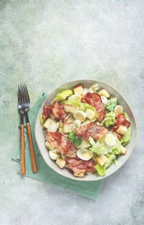 Caesar salad with fried bacon, quail eggs, homemade, no people