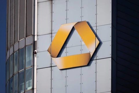 The sun shines on the logo of Commerzbank, Frankfurt am Main, Hesse, Germany