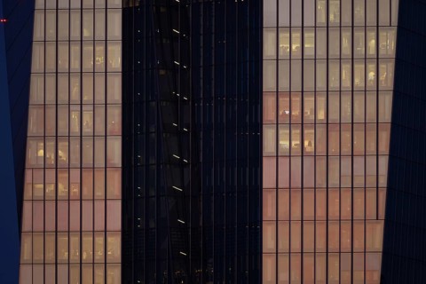 The setting sun shines on the glass façade of the European Central Bank (ECB) in Frankfurt am Main,