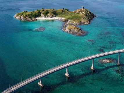 Sommaroy Bridge connecting Kvaloya Island to Sommaroy Island, small islands, turquoise water,