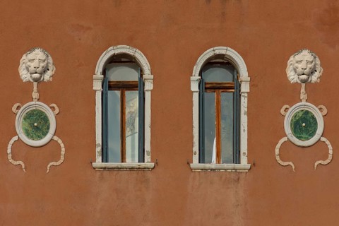 Lion heads at a palace, Venice, Veneto, Italy