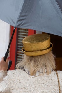 Woman with umbrella and golden hat, Venice, Veneto, Italy