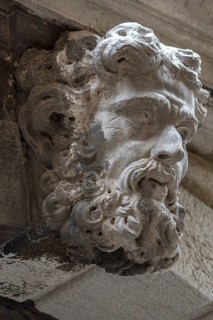 Sculpture of a man above a gate entrance, Venice, Veneto, Italy