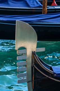 The metal tail of a gondola with six points symbolizing the six districts of Venice, Venice,