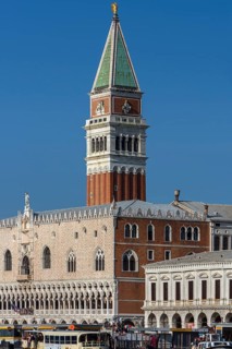 Spire of St. Mark's Campanile, in front the Doge's Palace, blue sky, Venice, Veneto, Italy