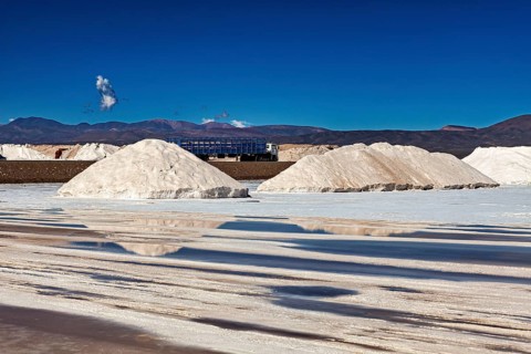 Salt heaps and industrial plants under a blue sky in a desert-like landscape, The Salar de Cauchari