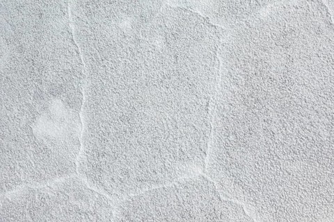 Rough grey plaster surface with visible structure, The Salar de Cauchari salt pan near Salta in
