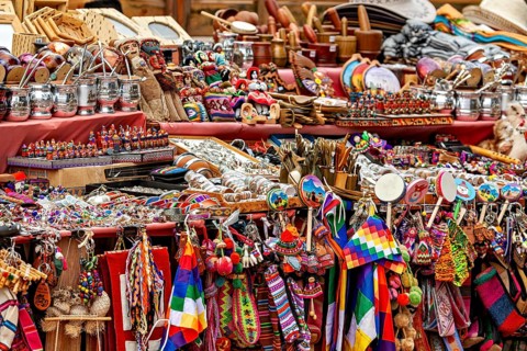 Colourful traditional crafts and souvenirs on a market stand, tourist and souvenir market of Santa