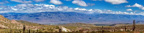 Panoramic picture of a wide mountain landscape with valley and clear sky, The landscape of the
