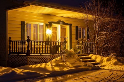 Entrance to a house lit by a lamp, Region of la Mauricie, Province of Quebec, Canada