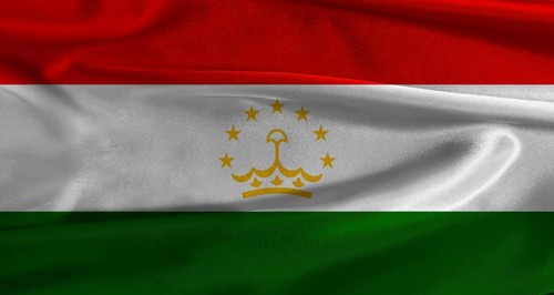 Flag of Tajikistan with fabric textured background. Close up of National flag of Tajikistan with