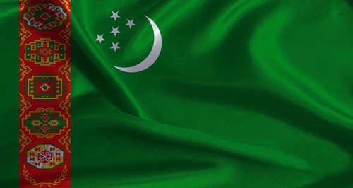 Turkmenistan flag with cloth textured background. National flag of Turkmenistan with realistic