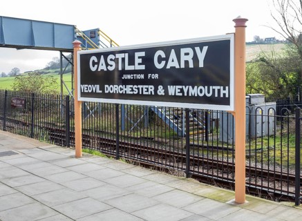 Railway station platform sign Castle Cary junction for Yeovil Dorchester and Weymouth, Castle Cary,