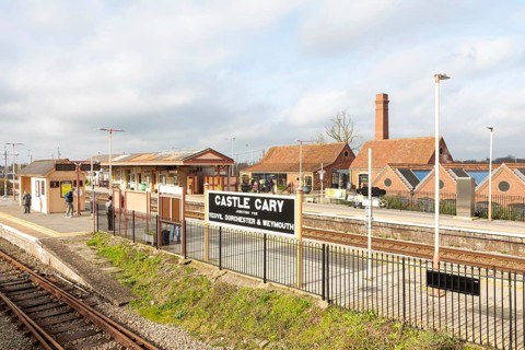 View over railway station platforms and buildings, Castle Cary, Somerset, England, UK