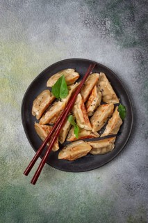 Japanese fried dumplings, gyoza, sesame seeds, top view, no people
