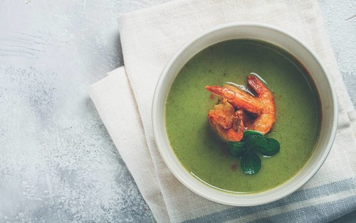 Pea cream soup, with shrimp, green soup, homemade, top view, no people
