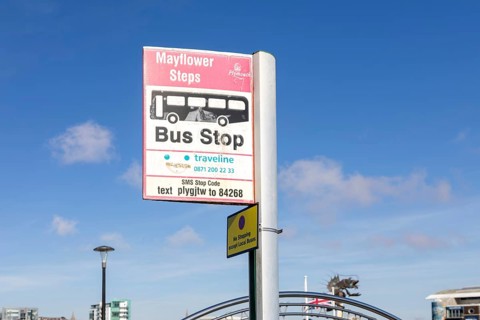 Traveline bus stop sign, Mayflower Steps, Sutton Harbour, the Barbican, Plymouth, Devon, England,