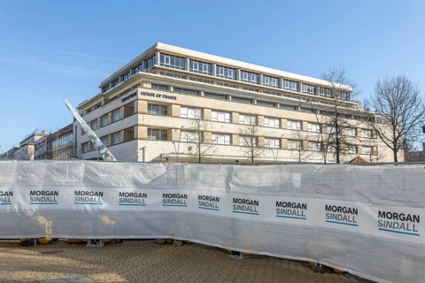 Morgan Sindall construction site screens with House of Fraser building, city centre of Plymouth,