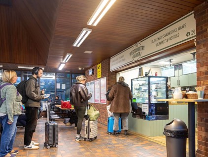 Passengers queuing at The Westcountry Larder Coffee takeaway shop shop, Tiverton Parkway railway