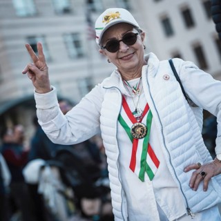 A participant in the colors of Iran at the demonstration by exiled Iranians under the motto Freedom