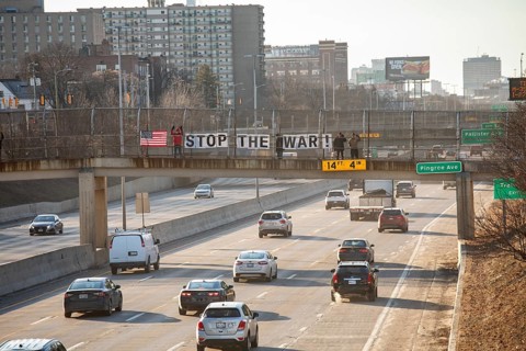 Detroit, Michigan USA - 2 March 2026 - Signs are posted on a pedestrian crosswalk over a freeway