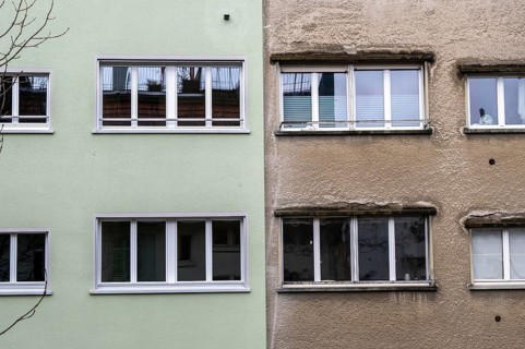 Windows, gray house facades, a house is renovated, renovation, modernization, contrast, difference,