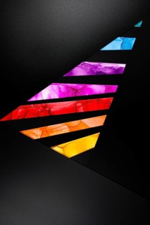 Colorful abstract design with geometric shapes in vivid hues on paper. Dynamic contrast of purple,