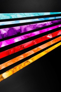Striking diagonal streaks of vibrant colors inks including blue, purple, pink, red, and yellow