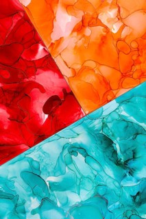 An abstract artwork featuring vibrant red, orange, and blue fluid patterns. The colors inks create