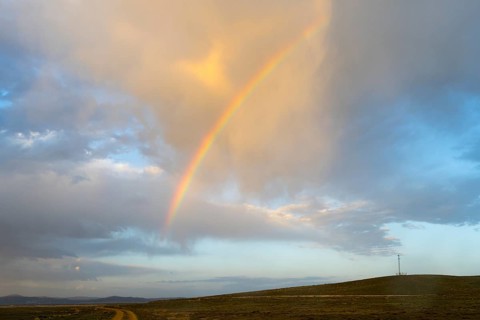 Gentle evening mood with a rainbow over open countryside and clouds at the salt lake, Tuz Gölü,