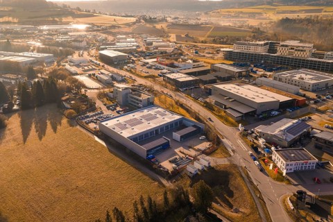 Panoramic aerial view of an industrial complex surrounded by fields and roads, Calw, Calw district,