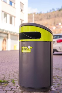 Modern trash can in an urban environment with buildings in the background, Calw, Calw district,
