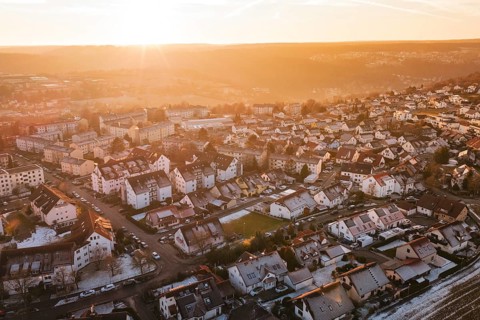 Panoramic view of a city at sunrise with golden light and peaceful atmosphere, Calw, Calw district,