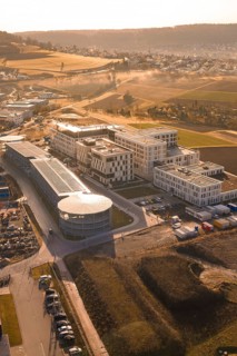 Industrial complex with modern buildings in a rural area with fields, new hospital at the Calw