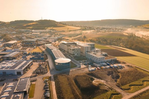 Aerial view of modern buildings in a vast rural area in the morning haze, new hospital at Calw