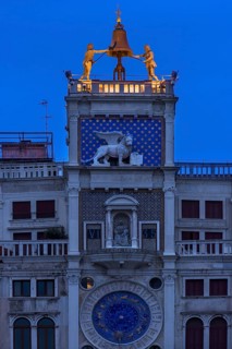 Two bronze figures ring the bell on the clock tower, dawn, Venice, Veneto, Italy