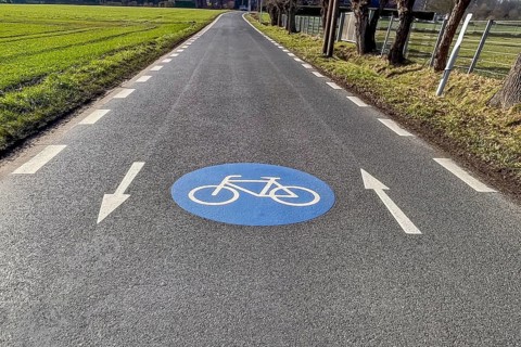 Large marking on narrow district road country road in rural area painted symbol for road signs 244